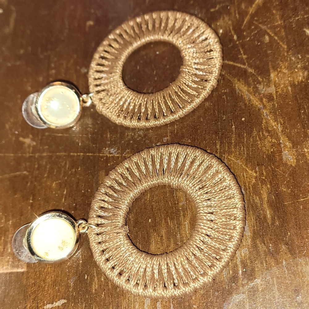 Beautiful woven earrings tan in color rose gold stud with gold flakes.